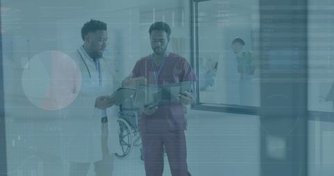 Doctors Analyzing Medical Data on Digital Devices in Hospital