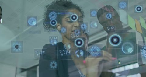 Business Team Examining Holographic Interface with Futuristic Displays