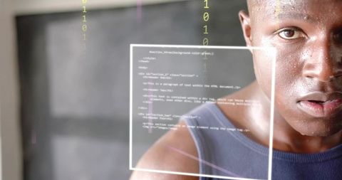 Developer viewing holographic code interface with binary overlay, futuristic portrait