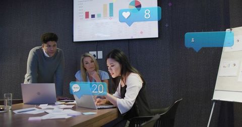 Team Collaborating on Data Analysis and Social Media Engagement Overlays in Boardroom