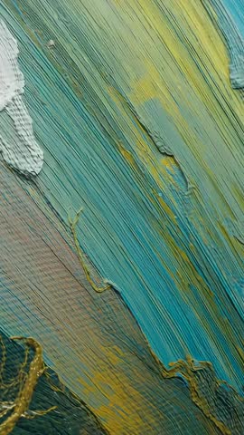 Vertical video capturing metallic acrylic brush strokes focusing on textured turquoise gold canvas