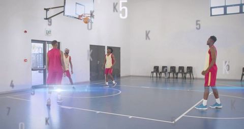 Indoor basketball team practicing layups on blue court with light flare and motion overlay