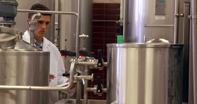 Scientist Working with Industrial Equipment in Laboratory Setting - Download Free Stock Images Pikwizard.com