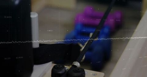 Braided cable assembly through metal guide in workshop environment