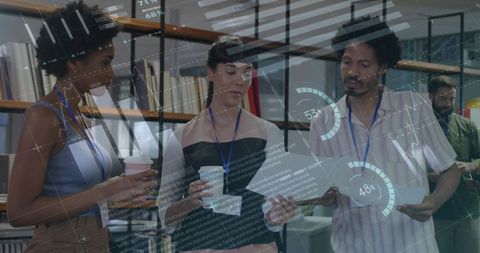 Diverse Team Analyzing Data Metrics in Modern Office