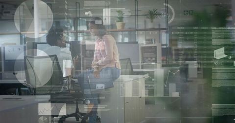 Business Colleagues Analyzing Digital Data Projections in Modern Office
