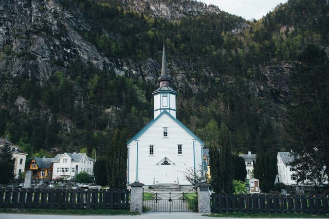 Historic White Church in Serene Mountain Village - Download Free Stock Photos Pikwizard.com