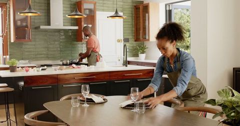 Couple Engaging in Meal Preparation in Stylish Home Kitchen