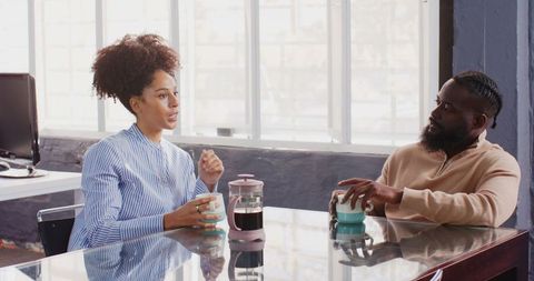 African American Colleagues Chatting During Office Coffee Break