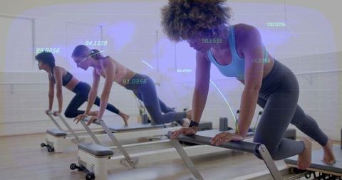 Diversely Energetic Women Doing Pilates with Fitness Tech Overlay