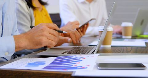 Business Professionals Analyzing Data in Collaborative Meeting - Download Free Stock Images Pikwizard.com