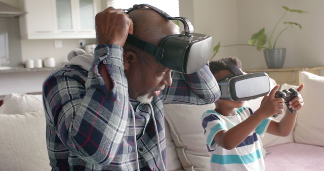 Grandfather and Grandson Enjoying Virtual Reality Gaming at Home - Download Free Stock Images Pikwizard.com