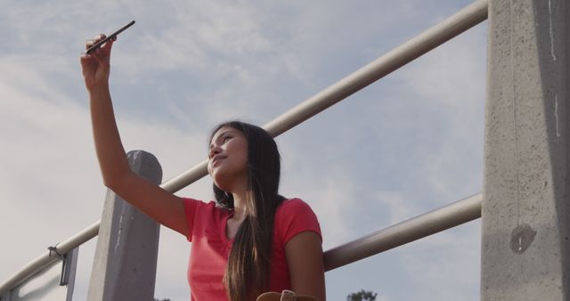 Young Woman Taking Selfie Outdoors on Bright Sunny Day - Download Free Stock Images Pikwizard.com