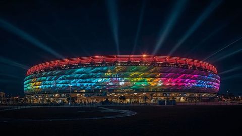 Illuminated stadium at night with colorful led display