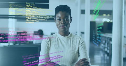 Confident businesswoman in modern office near data graphics