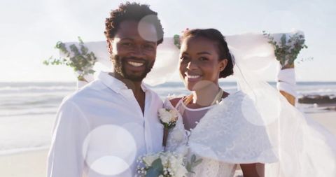 Joyful African American Couple at Beachfront Wedding