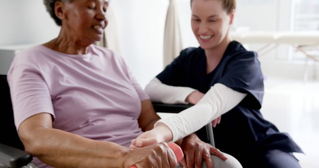 Physical Therapist Assisting Senior Woman Wid Grip Strength Exercise - Download Free Stock Images Pikwizard.com