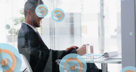 Businessman Analyzing Data With Digital Icons Overlay