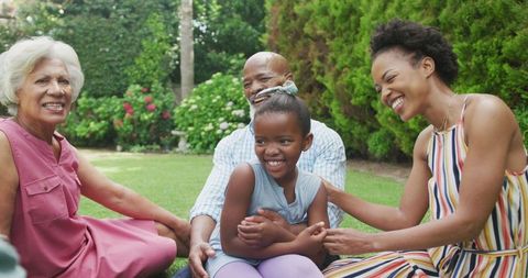 Joyful Multigenerational Family Gathering in Lush Garden