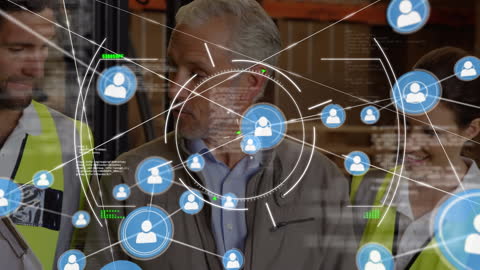 Warehouse Workers Discuss Technology Amid Digital Connectivity