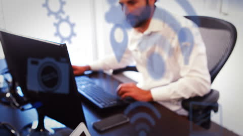 Overlay of Digital Network Icons on Business Professional Working