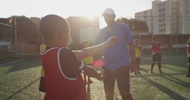 Young Boys Training Soccer on Sunny Day with Coach - Download Free Stock Images Pikwizard.com