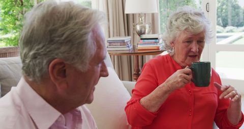 Senior Couple Chatting with Coffee in Bright Living Room - Download Free Stock Images Pikwizard.com