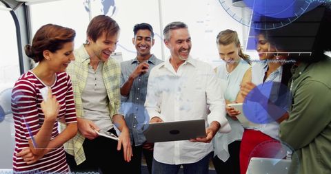 Diverse Team Collaborating on Device with Digital Interface