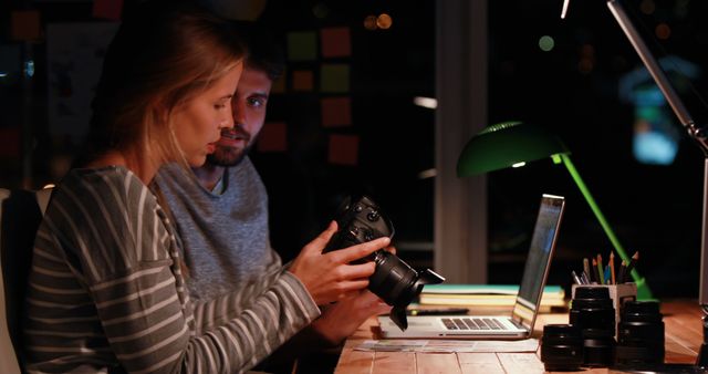 Young Photographers Collaborating on Photography Project at Night - Download Free Stock Images Pikwizard.com