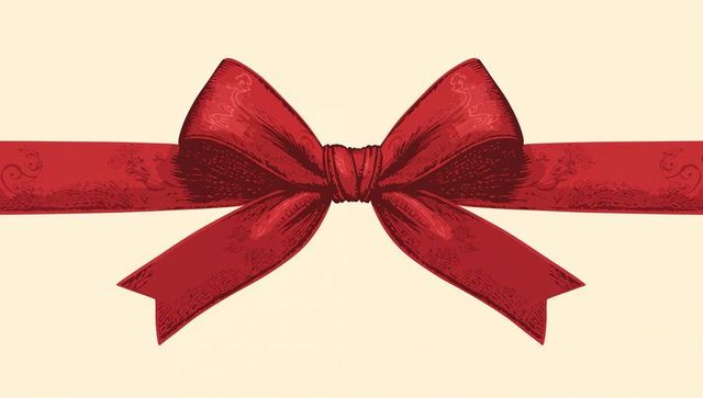 Engraved red ribbon bow on cream background for elegant gift wrap, holiday celebration