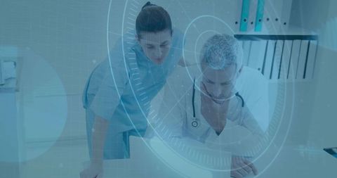 Medical team reviewing patient data on laptop with futuristic digital hud overlay