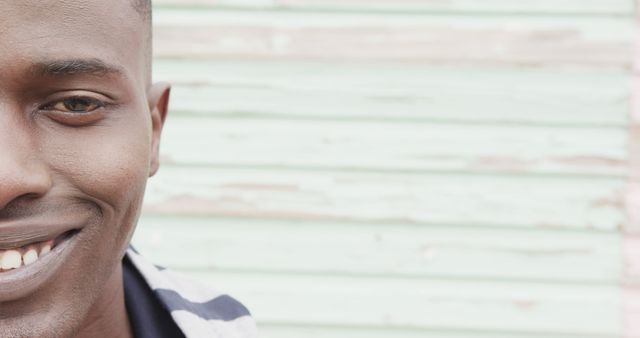 Close-Up of Smiling African American Man Against Pastel Wall - Download Free Stock Images Pikwizard.com