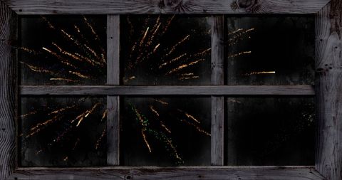 Vivid Fireworks Display Viewed Through Rustic Window