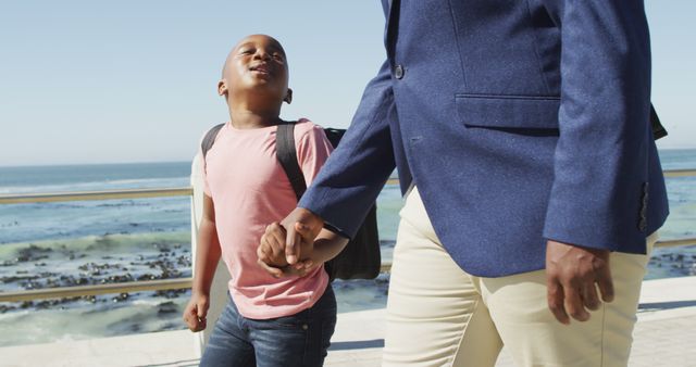 Father and Son Walking Hand in Hand Near Beach - Download Free Stock Images Pikwizard.com