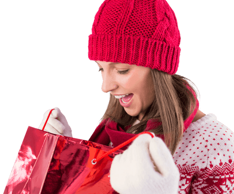 Surprised woman in winter attire holding red gift bag transparent background