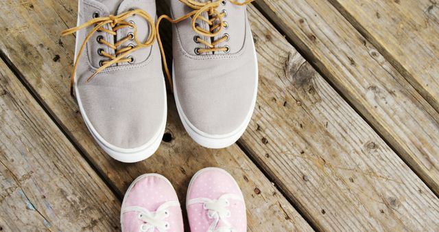 Adult Shoes and Baby Shoes on Wooden Deck - Download Free Stock Images Pikwizard.com