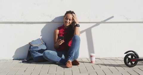 Young Woman Relaxing Outdoors with Smartphone on Sunny Day - Download Free Stock Images Pikwizard.com