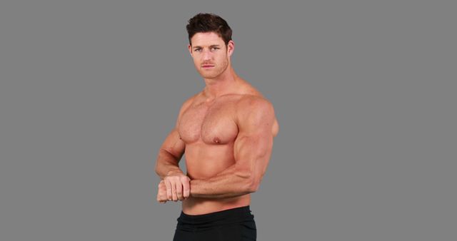 Muscular Man Posing Shirtless on Gray Background - Download Free Stock Images Pikwizard.com