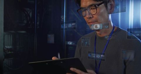 Technician using tablet stylus with digital holograms in data center