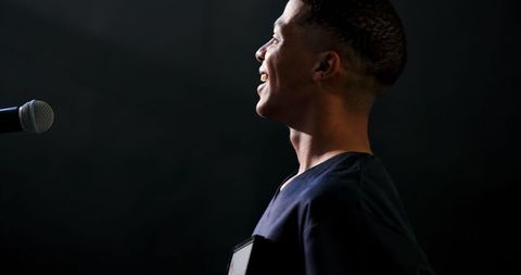 Joyful award ceremony: male doctor accepts recognition on stage