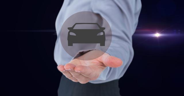 Businessman standing against dark background with holographic car icon on open hand, emphasizing automotive technology and innovation. Useful for topics on modern technology, auto industry advancements, professional business presentations, and car-related services.