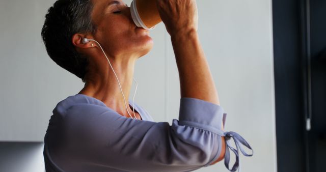 Mature Woman Drinking Coffee and Listening to Music - Download Free Stock Images Pikwizard.com