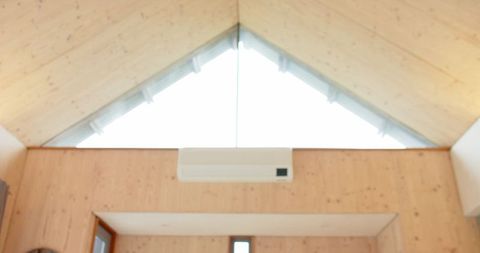 Modern hvac unit cooling scandinavian style wood cabin interior