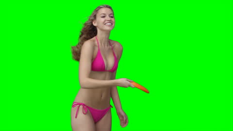 Smiling Woman in Bikini Playing with Frisbee