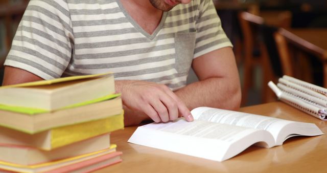 Male Student Studying with Books in Library - Download Free Stock Images Pikwizard.com