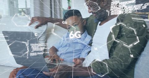 Father introducing son to cutting-edge 6g technology at home