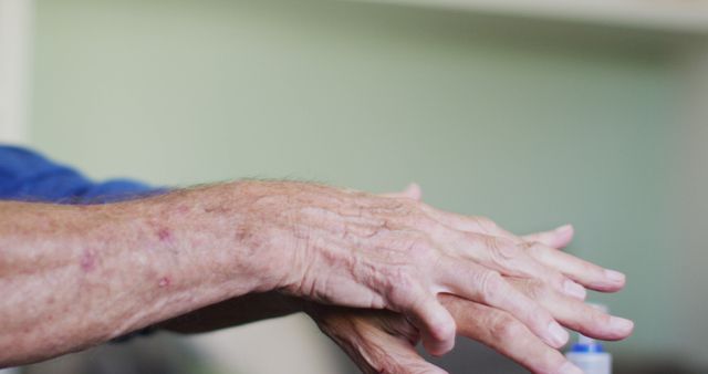 Close-up Elderly Hands Rubbing Lotion - Download Free Stock Images Pikwizard.com