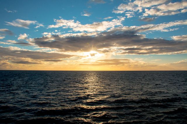 Stunning Ocean Sunset with Dramatic Clouds - Download Free Stock Photos Pikwizard.com