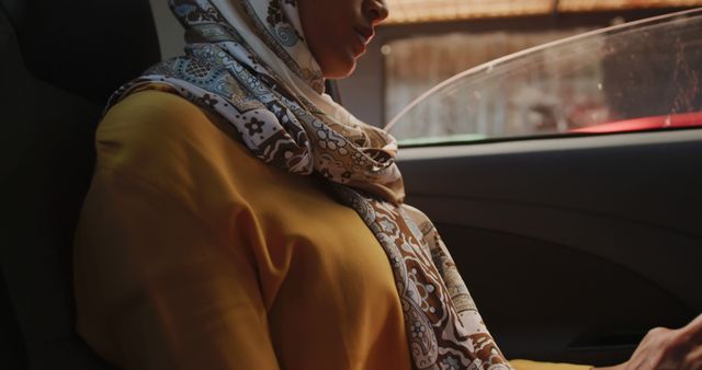 Woman in Traditional Hijab Sitting in Car - Download Free Stock Images Pikwizard.com