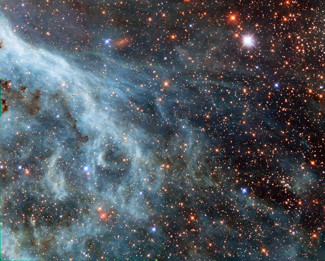 The brightly glowing plumes seen in this image are reminiscent of an underwater scene, with turquoise-tinted currents and nebulous strands reaching out into the surroundings.  However, this is no ocean. This image actually shows part of the Large Magellanic Cloud (LMC), a small nearby galaxy that orbits our galaxy, the Milky Way, and appears as a blurred blob in our skies. The NASA/European Space Agency (ESA) Hubble Space Telescope has peeked many times into this galaxy, releasing stunning images of the whirling clouds of gas and sparkling stars (opo9944a, heic1301, potw1408a).  This image shows part of the Tarantula Nebula's outskirts. This famously beautiful nebula, located within the LMC, is a frequent target for Hubble (heic1206, heic1402).   In most images of the LMC the color is completely different to that seen here. This is because, in this new image, a different set of filters was used. The customary R filter, which selects the red light, was replaced by a filter letting through the near-infrared light. In traditional images, the hydrogen gas appears pink because it shines most brightly in the red. Here however, other less prominent emission lines dominate in the blue and green filters.  This data is part of the Archival Pure Parallel Project (APPP), a project that gathered together and processed over 1,000 images taken using Hubble’s Wide Field Planetary Camera 2, obtained in parallel with other Hubble instruments. Much of the data in the project could be used to study a wide range of astronomical topics, including gravitational lensing and cosmic shear, exploring distant star-forming galaxies, supplementing observations in other wavelength ranges with optical data, and examining star populations from stellar heavyweights all the way down to solar-mass stars.  Image Credit: ESA/Hubble &amp; NASA: acknowledgement: Josh Barrington  <b><a href="http://www.nasa.gov/audience/formedia/features/MP_Photo_Guidelines.html" rel="nofollow">NASA image use policy.</a></b>  <b><a href="http://www.nasa.gov/centers/goddard/home/index.html" rel="nofollow">NASA Goddard Space Flight Center</a></b> enables NASA’s mission through four scientific endeavors: Earth Science, Heliophysics, Solar System Exploration, and Astrophysics. Goddard plays a leading role in NASA’s accomplishments by contributing compelling scientific knowledge to advance the Agency’s mission. <b>Follow us on <a href="http://twitter.com/NASAGoddardPix" rel="nofollow">Twitter</a></b> <b>Like us on <a href="http://www.facebook.com/pages/Greenbelt-MD/NASA-Goddard/395013845897?ref=tsd" rel="nofollow">Facebook</a></b> <b>Find us on <a href="http://instagram.com/nasagoddard?vm=grid" rel="nofollow">Instagram</a></b>
